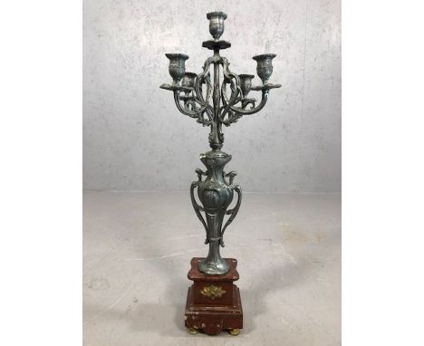 Five branch metal candelabra on stepped marble base, approx 64cm tall