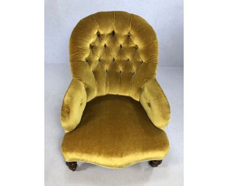 Antique fabric button back chair with original castors, approx 88cm tall