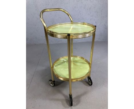 Vintage gold coloured circular tea trolley on wheels