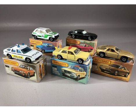 Five boxed Matchbox diecast model vehicles: 8 Rover 3500, Superfast 21 Renault 5TL, 56 Mercedes 450.SEL/Taxi, 59 Porsche 928,