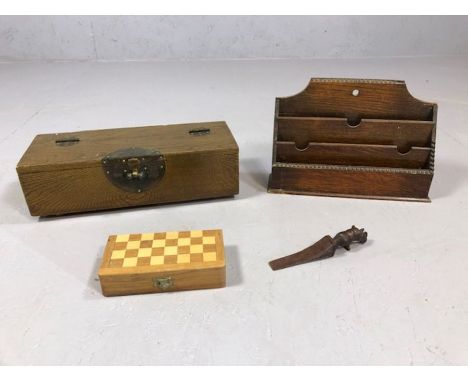 Small collection of wooden items to include Chinese style lidded box, letter rack, a rhinoceros wedge and a miniature chess s