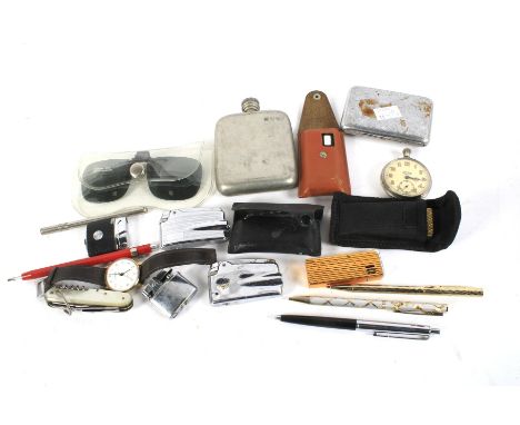 An assortment of collectables. Including a hip flask, pocket watch, lighters and a cigarette case