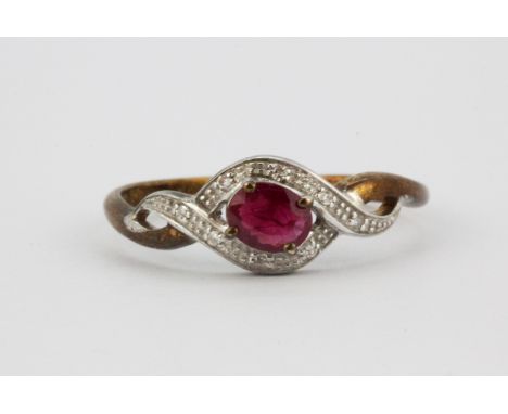 A 9ct yellow gold ruby and diamond set ring, (O.5).