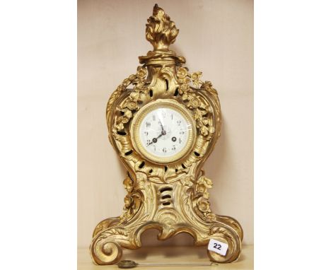 A 19th Century French gilt brass mantle clock with striking movement, H. 51cm. Working condition : understood to be in good w