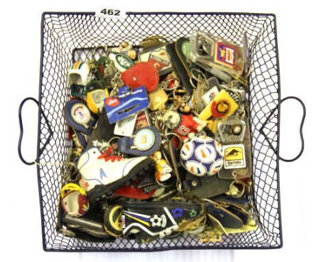 A large quantity of vintage sporting related keyrings.