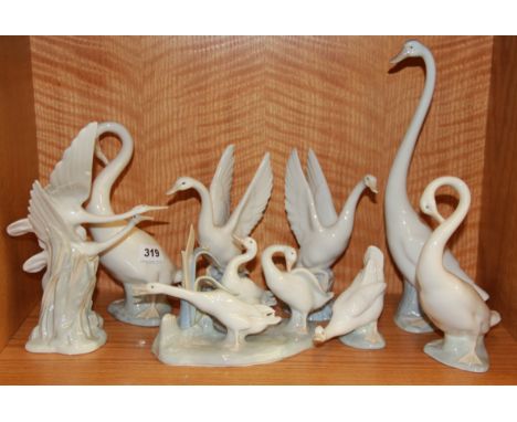 Seven porcelain Nao figures and one Lladro figure, all of geese and ducks, tallest 35cm.