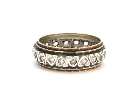 A 9ct yellow gold and silver stone set full eternity ring, (one stone missing), (R).