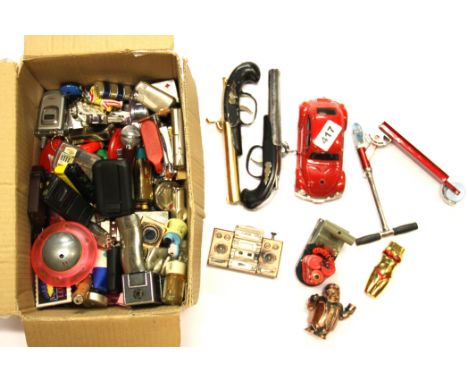 A quantity of vintage novelty lighters.