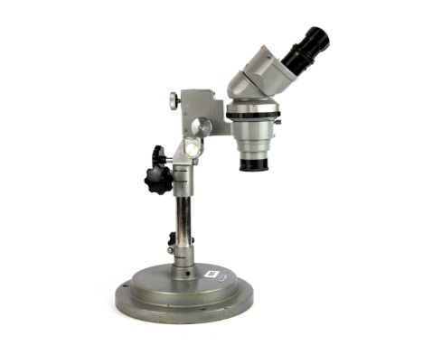 A Nikon binocular microscope, H. 46cm.