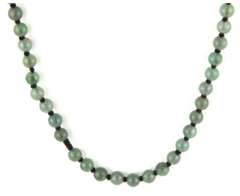 A single strand necklace of jade beads, bead size 5.5mm necklace L. 54cm.