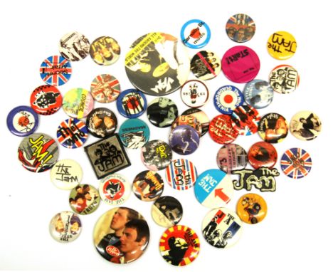 A quantity of vintage pop culture badges including The Jam, Style Council etc.