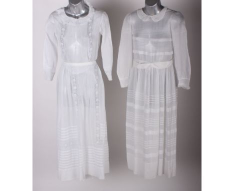 A early 20th Century fine white voile skirt and matching blouse with pin tucks and embroidered detail; a fine white cotton an