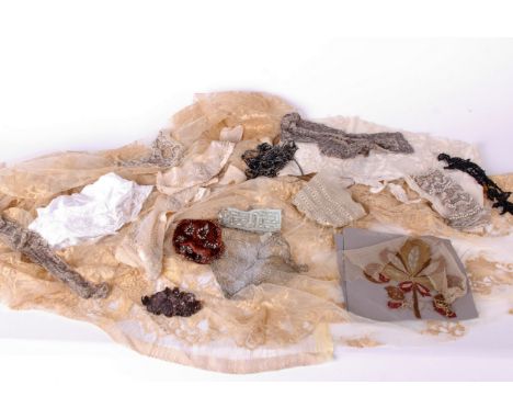 A cream lace bolero jacket; 1930s floral appliqué panel, a deconstructed lace blouse, a white embroidered panel, a collection