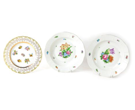 A pair of Herend of Hungary porcelain soup plates, with central decorated hand painted floral sprays and basket weave border,