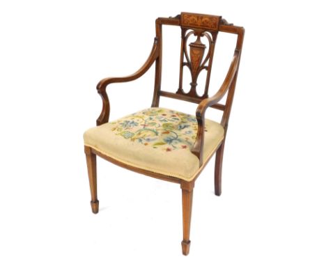 An Edwardian marquetry carver chair, with urnular splat, inlaid with scrolling decoration and tapestry seat.