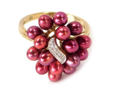 A 9ct gold cultured pearl cluster ring, the pearls with red/pink lustre on a central panel set with four tiny diamonds, ring 