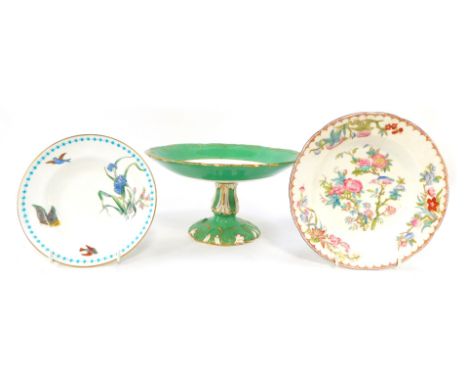 Three 19thC and later porcelain plates, comprising a 19thC cake stand, with green gilt border, and central ruin, 13cm high, a