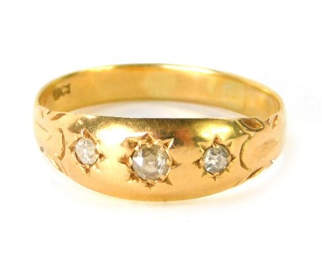 A diamond gypsy ring, set with three old cut diamonds, each illusion set, the largest 0.10cts, flanked by two smaller stones,