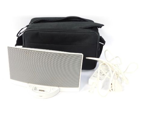 A Bose portable speaker, with carry case and cable.