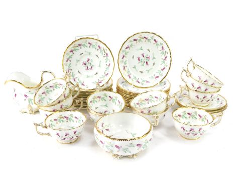 A Victorian porcelain tea service, comprising twelve cups and saucers, side plates, milk jug and sugar bowl.