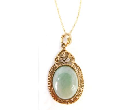 A 9ct gold jade necklace, the oval pendant set with light jade in a pierced basket setting, 4.5cm high, on a fine link neck c