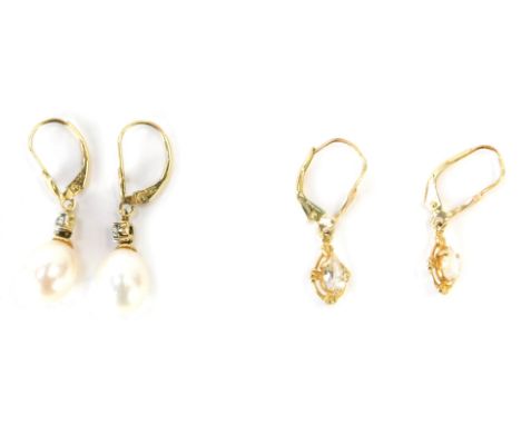 Two pairs of earrings, to include a pair of 9ct gold cultured pearl and diamond set drop earrings, 3.5cm high together with a