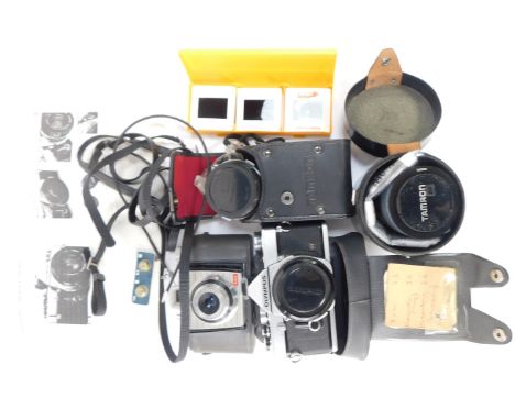 Camera and optics equipment, comprising Olympus MD camera, Kodak Flash, Tamron SP lens, Olympus 28mm lens, and a Kodak Colour