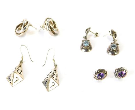 Four various pairs of silver earrings, to include a pair of interlinked circular earrings, diamond set hoops, aquamarine set 