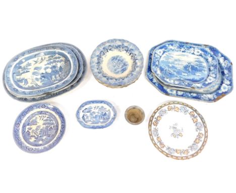 A group of blue and white wares, comprising a set of three graduated Willow pattern meat plates, large graduated meat plate a