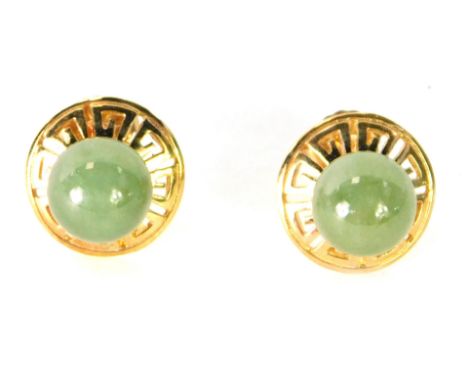 A pair of 9ct gold and dark green jade earrings, each of circular design with outer Aztec border, 4g all in, boxed.