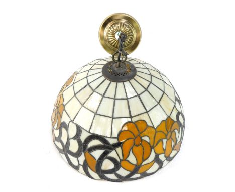 A Tiffany style hanging lamp shade, painted in cream with yellow flower design and hanging brass central plate, 38cm diameter