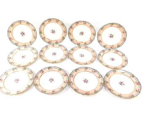 A set of twelve Aynsley dessert plates, each with a gilt rim and border, decorated with roses on a pink outer ground and crea