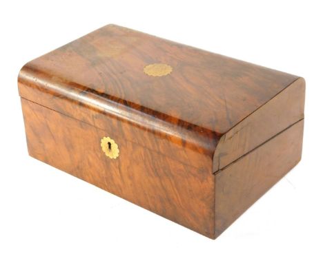 A 19thC walnut writing box, with domed lid, with brass central plates and key plate, 15cm high, 35cm wide, 22cm deep.
