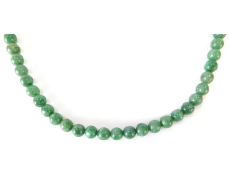 A jade necklace, with spherical light green jade beads, 4mm wide, on a 9ct gold chain and clasp, 45cm long, 40.5g all in.