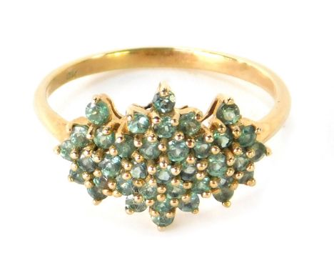 A 9ct gold dress ring, with light green set three point stone cluster, in claw setting, ring size P½, 2.6g.