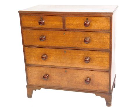 A George III oak chest, of two short and three long graduated drawers, with turned knob handles, and bracket feet, 100cm wide