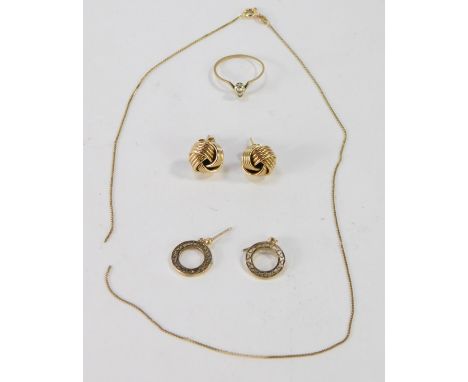 A group of scrap gold, comprising a pair of 9ct gold knot earrings, a pair of 9ct gold circular disc earrings, yellow metal c