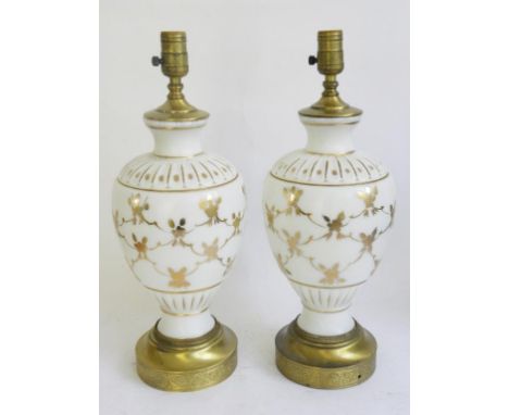 A PAIR OF BRASS MOUNTED GILT OPAL GLASS VASES MOUNTED AS TABLE LAMPS 