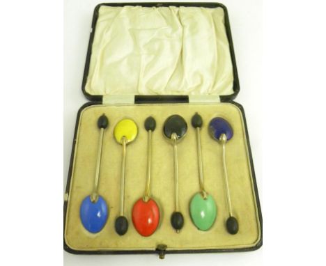 A SET OF SIX SILVER AND HARLEQUIN ENAMEL COFFEE SPOONS, APPARENTLY UNMARKED, CASED, 1OZ 10DWTS