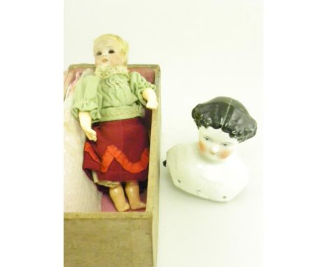 A GERMAN BISQUE HEADED MINIATURE DOLL WITH PADDED CLOTH BODY AND COMPOSITION LIMBS, CIRCA 1900 AND A CONTINENTAL PORCELAIN DO