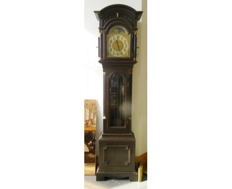 AN EBONISED OAK LONGCASE CLOCK, THE BRASS DIAL WITH LUNAR WORK TO THE ARCH, THE MOVEMENT CHIMING ON ROD GONGS, THE TRUNK ENCL