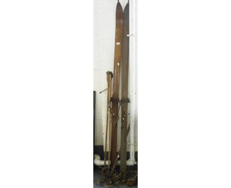 A PAIR OF VINTAGE WOODEN SKIS, A PAIR OF BAMBOO SKI POLES AND AN ICE AXE