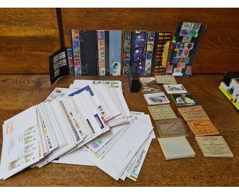 Collection of First Day Covers stamps, topographical snap shot albums and usable stamps.