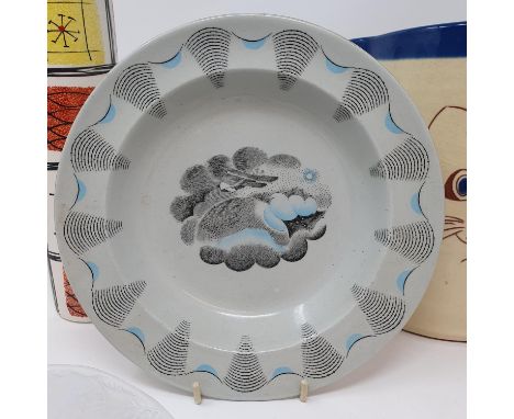 A Wedgwood Edward Ravilious travel pattern bowl, 21 cm diameter, a jug, decorated cat, 20 cm, a rolling pin, lacking handles,