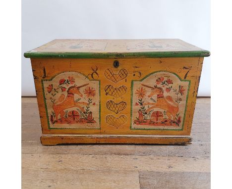 A 19th century painted trunk, decorated unicorns and flowers, painted 1857, 91 cm wide 