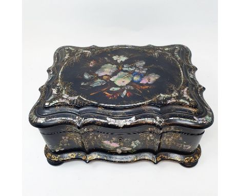 A 19th century papier-mâché serpentine sewing box, inlaid with mother of pearl, decorated flowers, the interior revealing a f
