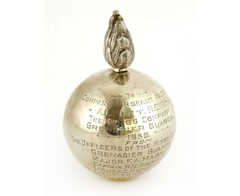 A silver Grenadier Guards table cigar lighter,by A &amp; J Zimmerman, Birmingham, 1932,of flaming grenade form and inscribed 