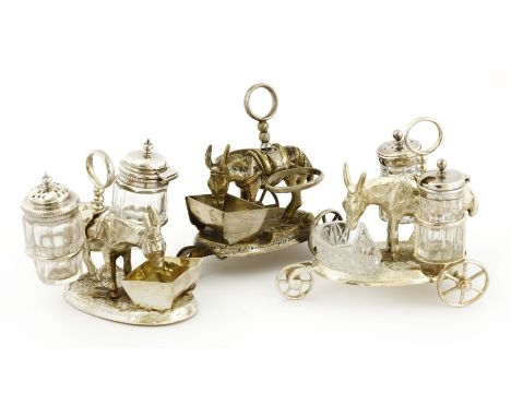 Two late Victorian silver electroplated donkey and trough cruet sets,each on three wheels, anda third set for restorationProv