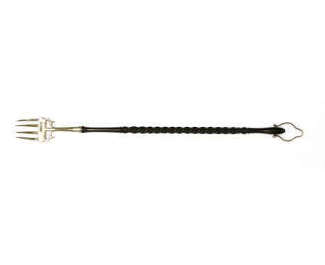 An Edwardian silver reproduction of a George III toasting fork,by Nathan &amp; Hayes, Chester, 1911,with a spiral twist eboni