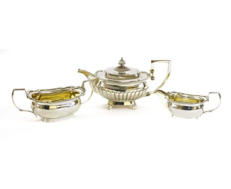 A George III composite three-piece silver tea serviceby Robert and Samuel Hennell, a teapot,London 1807,with fluted decoratio